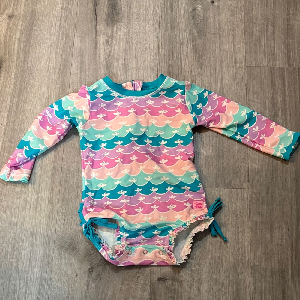 Ruffle Butts Long Sleeve One Piece Rash Guard Swim Suit With signature ruffles